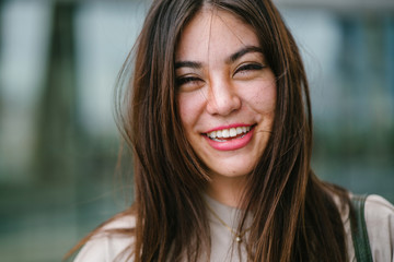 A close up photo of a young and attractive Japanese Asian woman. She has long black hair and is...