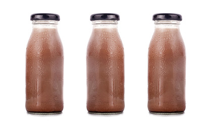 Various flavors of milk in bottles with chocolate