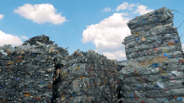 High stacks of trash on a sky background.