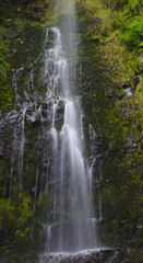 Waterfall among rocks. Madeira Island, Portugal, Europe. Long exposure photo.