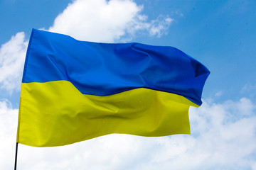 Flag of Ukraine against the blue sky. Horizontal shot.