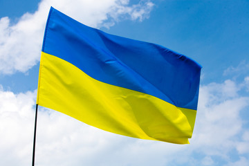 Flag of Ukraine against the blue sky. Horizontal shot.