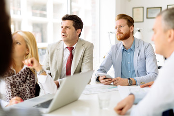 Business people using devices