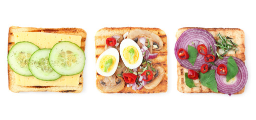 Different delicious toasts with vegetables on white background