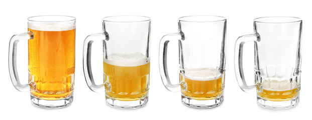 Mugs with different amount of beer on white background