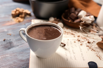 Cup of hot chocolate on wooden table