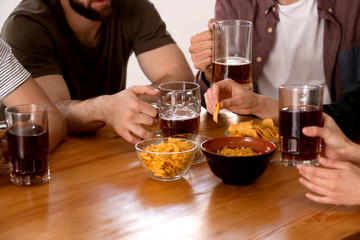 Friends drinking beer in bar