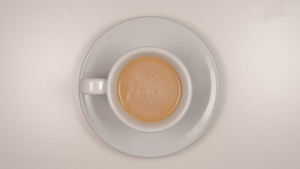 TOP VIEW: Latte coffee on a white table - 219953718
