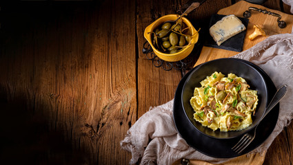 Reginette noodles in cream sauce with fresh chanterelles and capers