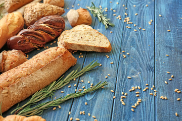 Different bakery products on wooden table