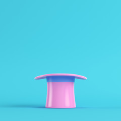 Pink top hat on bright blue background in pastel colors. Minimalism concept