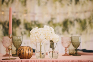 wedding decor, decorated table of the newlyweds, table setting, flowers, green and pink decor, candles
