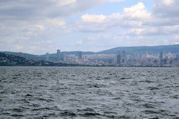 View from the sea cityscape with modern skyscrapers in business center of Istanbul