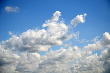 Blue sky with white clouds. Texture/Background