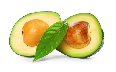Halves of ripe avocados on white background