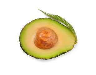 Half of ripe avocado with leaf on white background