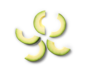 Slices of ripe avocado on white background, flat lay