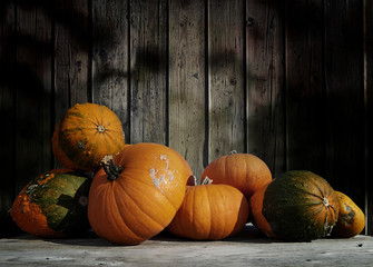 pumpkins on a table with textured wooden background