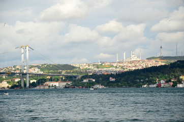 The Bosphorus Bridge and  Camlica Mosque.Uskudar.View from boat. Cityscape