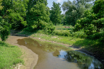 Fototapeta na wymiar Drying creek at park