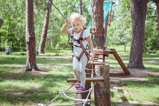 Child in forest adventure park.