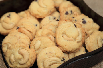 Almond and chocolate chip cookies in a box.