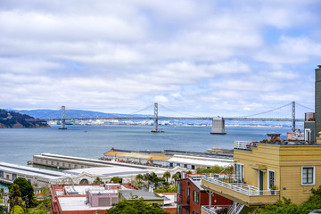 SAN FRANCISCO, CALIFORNIA, USA - MAY 15, 2018: View from the hill to the city port and Bay Bridge