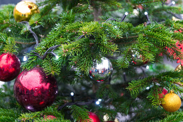 traditional New Year's wreaths and garlands, decorated with balls and ribbons, street architecture