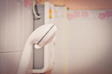 Shower in bathroom on vintage tone .