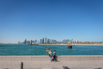 Doha, Qatar - Jan 9th 2018 - Locals and Residents enjoying a open area in Doha, public space, blue sky, in Doha, Qatar