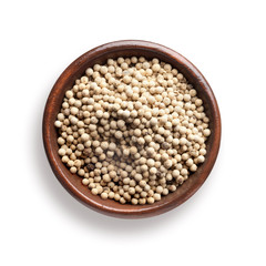 white pepper in a wooden bowl, isolated on white