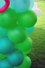 Colorful green and multicolor balloons at a party