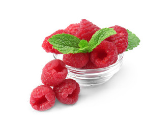 Bowl with fresh ripe raspberries on white background