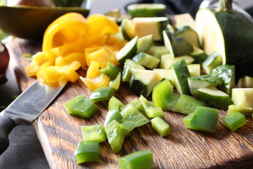 Board with ingredients for tasty vegetable salad, closeup