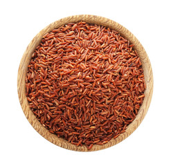 Wooden bowl with raw red rice on white background