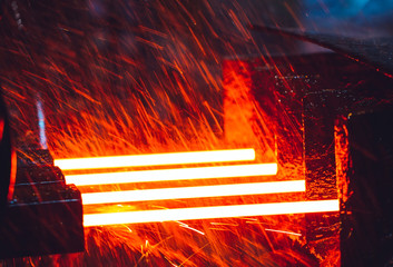 hot steel on conveyor in steel mill