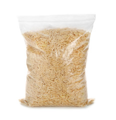 Zipper bag with raw brown rice on white background