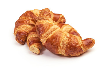 Freshly baked croissants, isolated on white background.