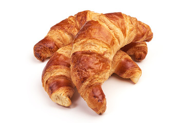 Freshly baked croissants, isolated on white background.