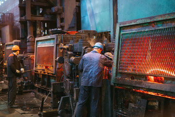 Workers in the steel mill.
