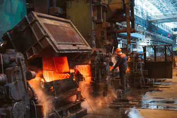 Workers in the steel mill. - obrazy, fototapety, plakaty