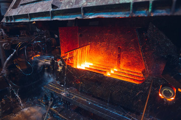 hot steel on conveyor in steel mill