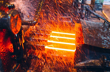 hot steel on conveyor in steel mill