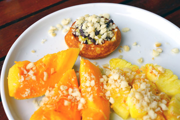Healthy breakfast with mini waffle and tropical fruit 