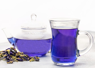 Organic blue tea Anchan, Clitoria, Butterfly Pea in glass cup and glass teapot