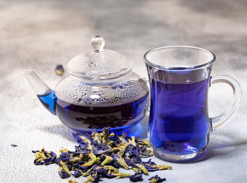 Organic blue tea Anchan, Clitoria, Butterfly Pea in glass cup and glass teapot