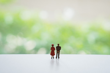 Miniature people, man standing alone with copy space using as business and people concept