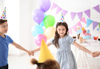 Cute little children celebrating Birthday at home