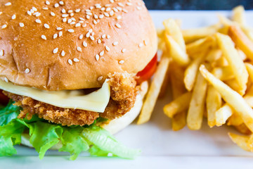 Cheese burger with fries.