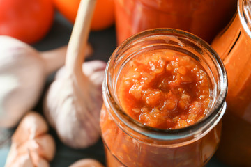 Jar with tasty sauce, closeup